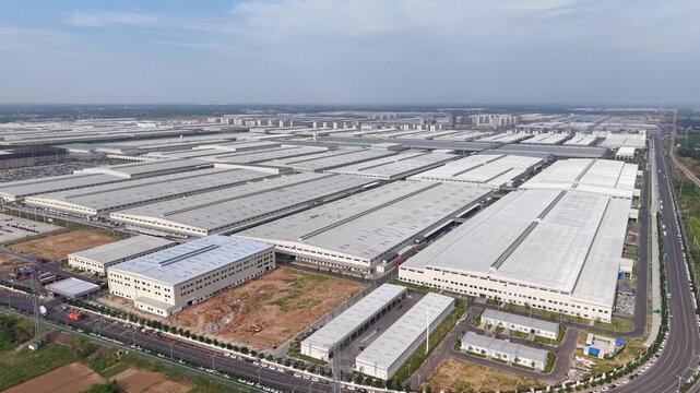 Aerial View of a Large Modern Industrial Factory Complex with Warehouses