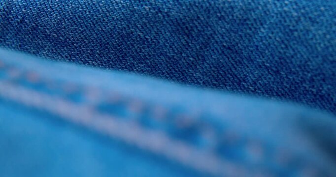 Close-up video of wrinkled denim fabric.abstract background.