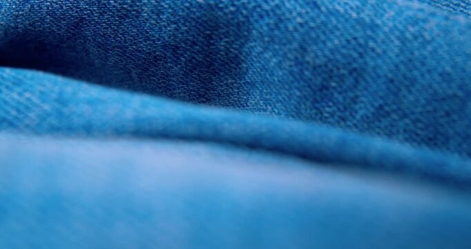 Macro shot of crinkled denim fabric.Abstract background.
