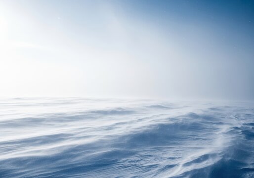 Intense snowstorm enveloping a frozen winter landscape with driving wind and heavy snowfall creating a severe whiteout condition, dramatic, landscape, snow