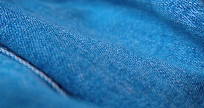 Macro shot of crumpled denim fabric.Abstract background.