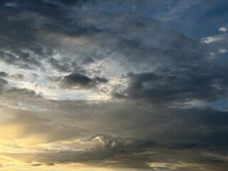 Obraz premium Dark Storm Clouds Golden Sunset Light
