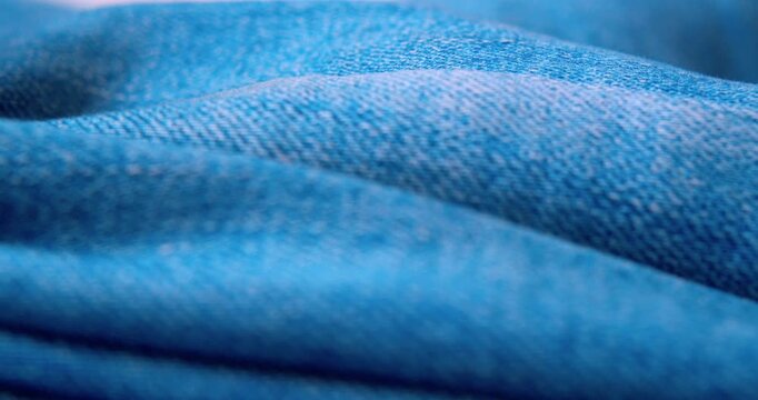 Macro shot of crinkled denim fabric.Abstract background.