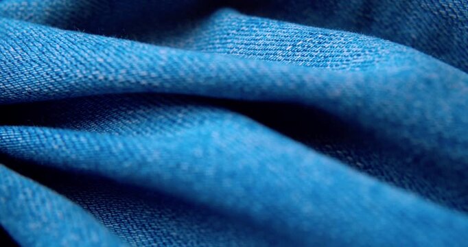Macro shot of crumpled denim fabric.Abstract background.