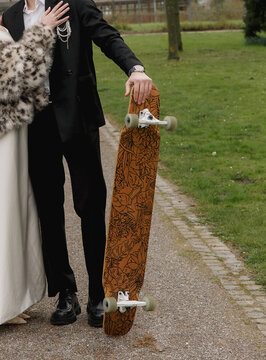 groom bride wedding dress fur coat corsage