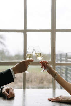 toasting glasses champagne hand bracelet ring window