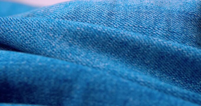 Macro shot of crinkled denim fabric.Abstract background.