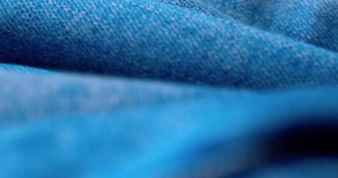 Macro shot of crinkled denim fabric.Abstract background.