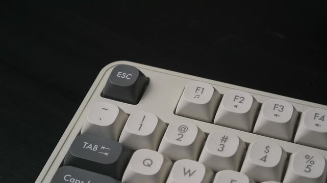 Close-up of a Finger Pressing the ESC Key on a Vintage Mechanical Keyboard
