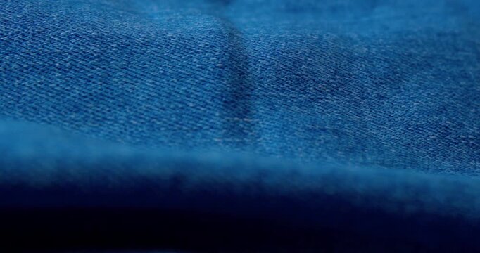 Macro shot of crinkled denim fabric.Abstract background