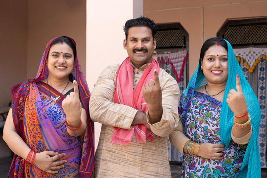Group of a Indian rural people showing finger after voting. voting sign in india. 
