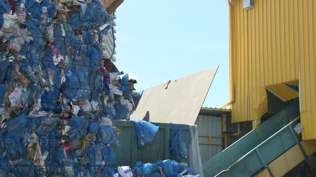 Crane Lifting Waste at a Modern Recycling Facility
