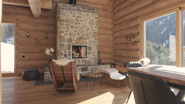 Luxurious and rustic living room interior of a wooden mountain chalet with a cozy fireplace