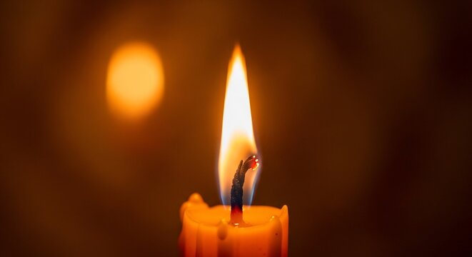 Burning candle flame close up