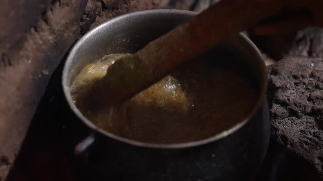 Close up of traditional African food cooking over open fire, April 25, 2026, Chad, N Djamena