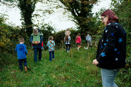 Family with parents and seven children taking a walk near their home