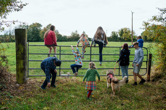 Family with parents and seven children taking a walk near their home