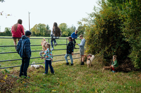 Family with parents and seven children taking a walk near their home