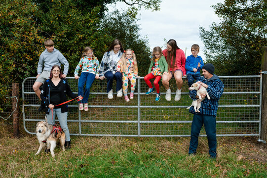 Family with parents and seven children taking a walk near their home
