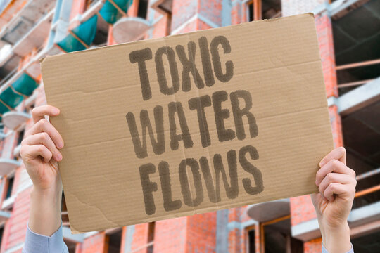 "Toxic Water Flows" Toxic industrial runoff flows unchecked into rivers supplying drinking water. TOXIC. RUNOFF. UNCHECKED. RIVERS. DRINKING.