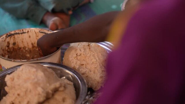 Close up of eating traditional African food by hand, April 25, 2026, Chad, N Djamena