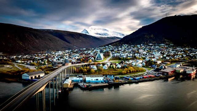 Iconic modern church, Tromsdalen Church, and city traffic at dusk in Tromso, Norway. Hyperlapse, Aerial forward
