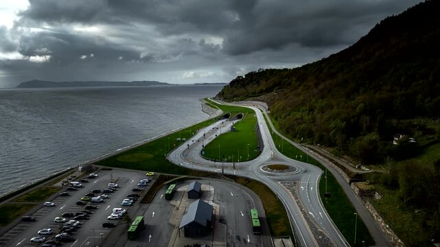 Hyperlapse of traffic on roundabout and road leading to Ryfast underwater tunnel system in Stavanger, Norway. Aerial forward