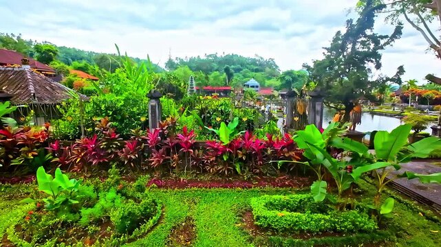 Lush tropical gardens surrounding Pura Tirta Empul temple in beautiful Bali