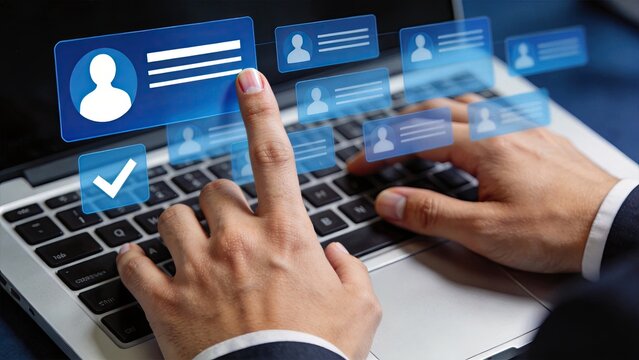 Hands selecting user profiles on laptop keyboard, digital identity management and contact list organization for social networking or database administration