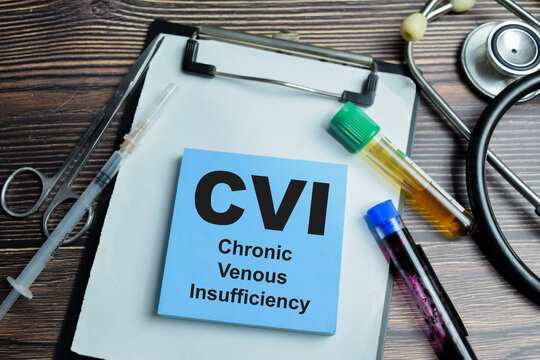 Concept of CVI - Chronic Venous Insufficiency write on sticky notes isolated on Wooden Table. For leading to increased pressure and strain on the vein walls