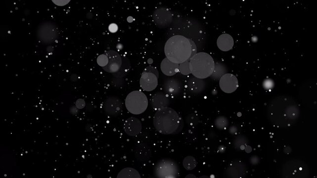 Particles and bokeh lights animation on black background 4k footage animation for background loop and titles and logos animation footage