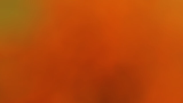 An abstract plastic leaf background image used to decorate a restaurant in a five-star hotel on Silom Road, Bangkok, Thailand. The background image features a blurred gradient of orange, black, and li