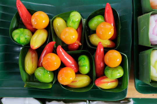 Colorful luk chup traditional thai desserts in banana leaf cups
