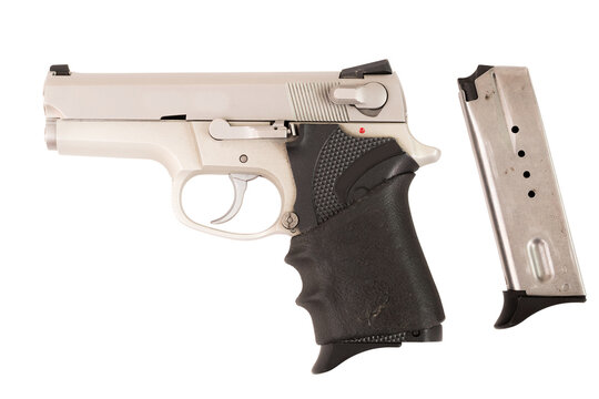 Pistol isolated over white background. Exemplar of firearm weapon closeup