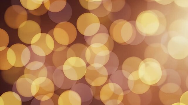 Soft bokeh in golden tones creates a warm, glowing background with overlapping light circles