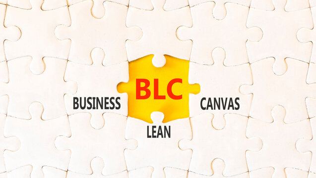 BLC business lean canvas symbol. Concept words BLC business lean canvas on beautiful white puzzles. Beautiful yellow background. BLC business lean canvas concept. Copy space.