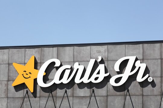 Nyborg, Denmark - July 2, 2022: Carl's jr logo on a wall. Carl's jr is an American fast food restaurant chain operated by CKE Restaurant Holdings, Inc