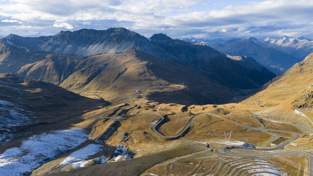 Stelvio pass winding road crossing scenic mountain landscape