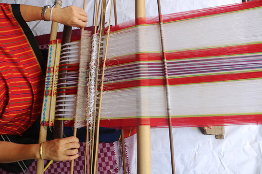 Loin loom weaver in India working in her loom.