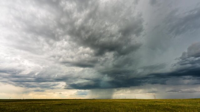Moving thunderstorm sky with dark clouds moving across horizon