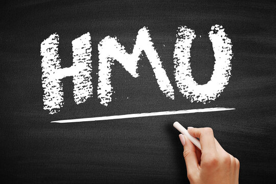 HMU stands for Hit Me Up. This acronym is handwritten in chalk on a chalkboard, underlined by a hand to show a request for contact in common internet slang and social media messaging.