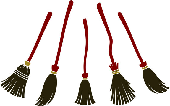 Collection of classic brooms with red handles, perfect for cleaning tasks or enchanting Halloween decor