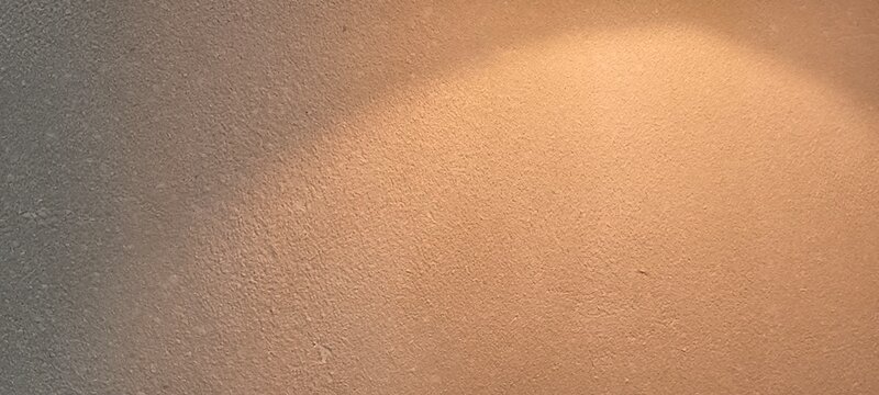 A wall surface with light falling on it.