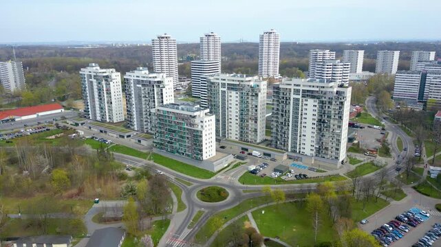 Wide aerial shot of modern housing estates and a roundabout in Katowice.