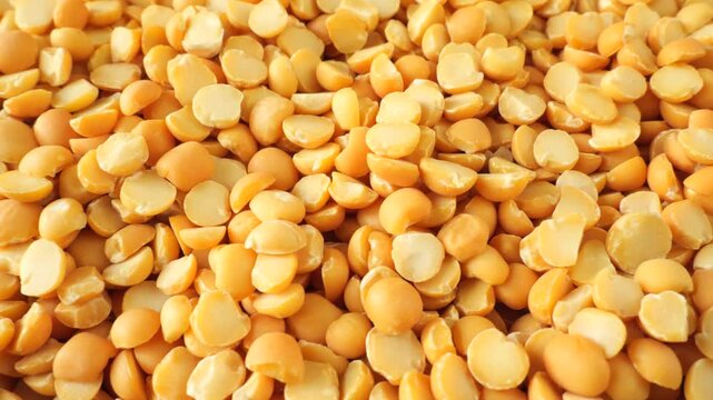 Yellow split peas rotating slowly