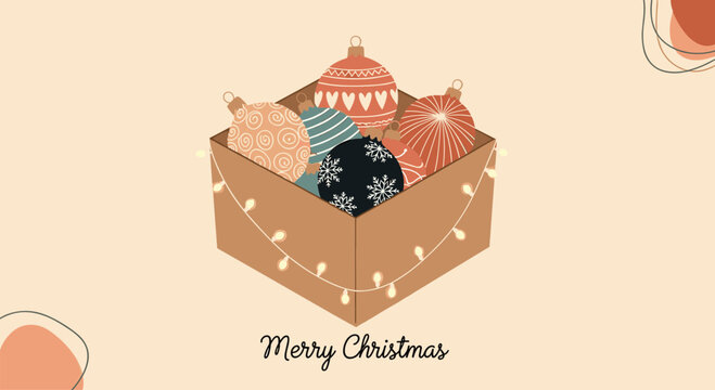 Cardboard box filled with colorful Christmas ornaments and string lights with a merry Christmas message on a warm background.