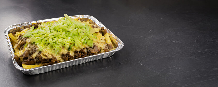 Ultra wide Dutch kapsalon food banner with dark copy space