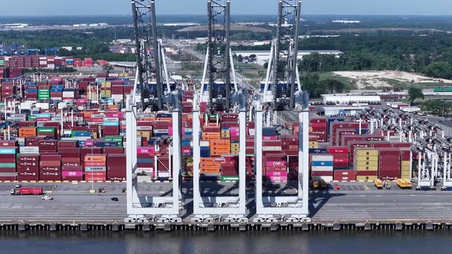 Industrial Shipping Activity and towers at Savannah Ports Authority with containers awaiting transport