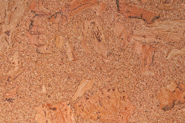 Fototapeta premium Brown corkboard texture with organic pattern. Close-up of natural granulated cork material background.