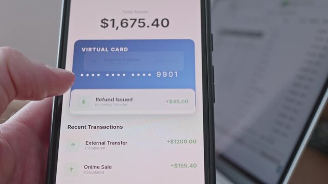 Person checking passive income and dividend payouts on mobile banking app